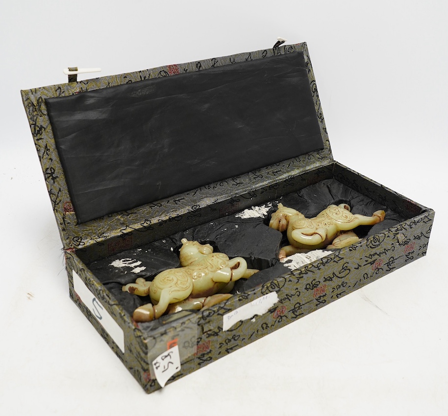 A pair of Chinese green jade horses, Han style, cased, 15cm wide. Condition - good